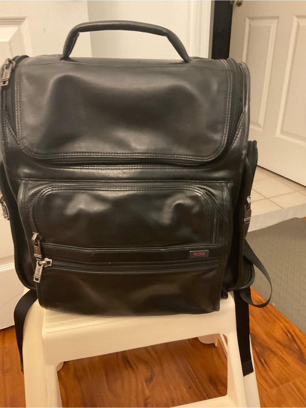 Tumi Black Leather Men’s Backpack with Front Zip Pockets
